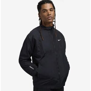 Nike NOCTA Men's Black Windbreaker Jacket with White Logo
